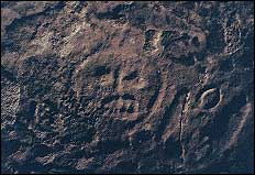 At more than a foot diameter, this stylized human face is one of the largest figures at the site.
